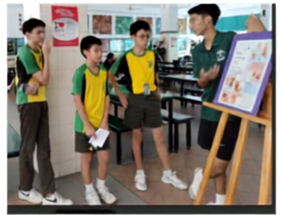 Secondary 4 students sharing health tips with their schoolmates.